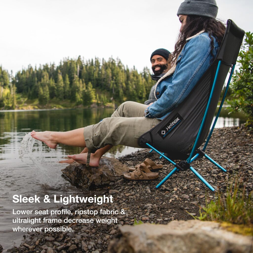 Couple sat in Helinox Chair Zero High‑Back
